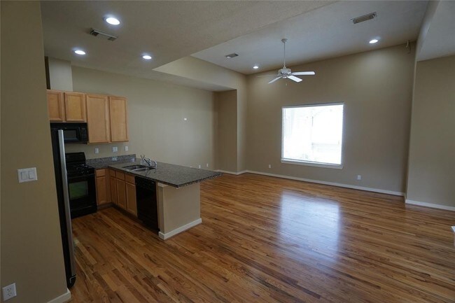 Building Photo - Elegant Gated Townhome Offering Unparallel...