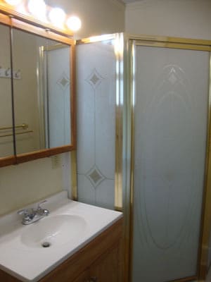 Bathroom with shower and vanity. - 512 S Center St