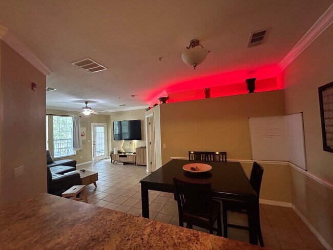 Building Photo - Walk to UF! Spacious & Furnished 3BD Condo...