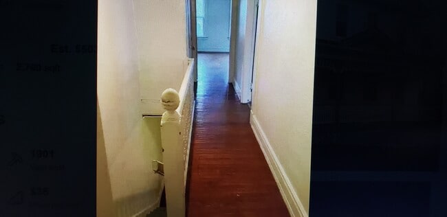 Wood floors upstairs in hallway and bedrooms - 921 E 7th St