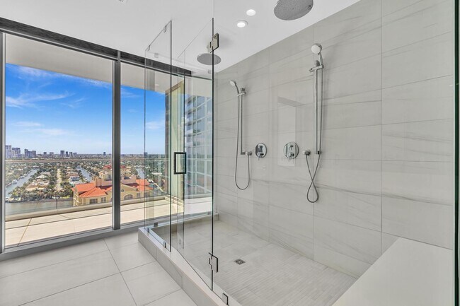 Building Photo - Stunning High-Rise Condo with Ocean Views | Prime Beach Location