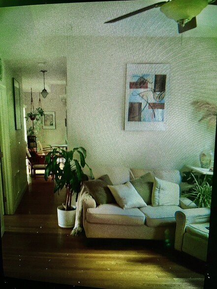 Den and hallway leading to eat in kitchen and full deck! Cook & enjoy in comfort on your deck! - 19 Ackley Pl