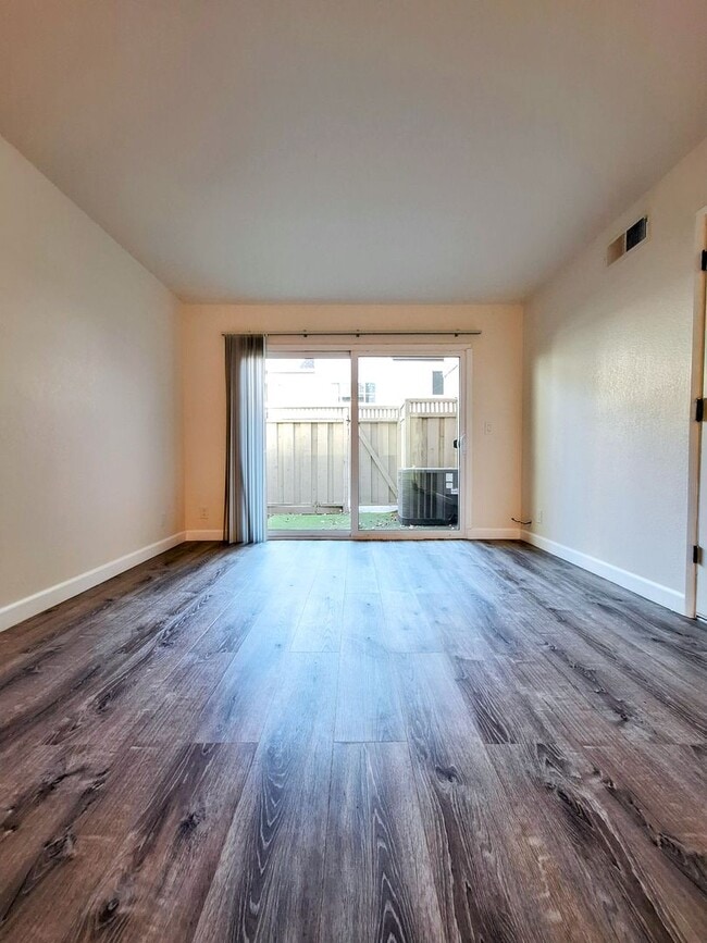 Building Photo - Spacious Two-Story 3bd Townhouse With Private Patios, Balcony, & Garage