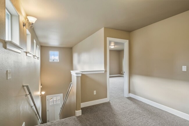 Building Photo - Spacious 4-Bedroom Home with New Paint & Carpet, Fenced Yard