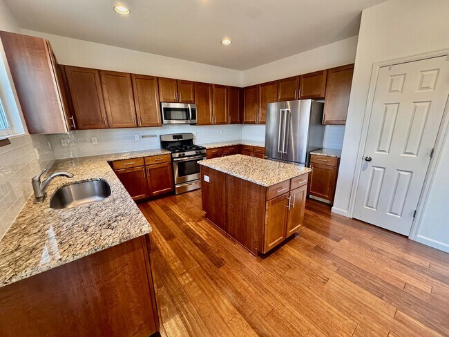 Building Photo - Large 4 bedroom home with a Fully Finished...
