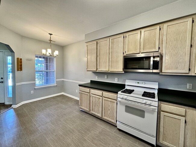 Building Photo - Ready NOW!! A 3-Bedroom Townhome w/Attache...