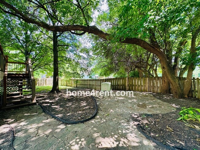 Building Photo - Blue Valley Schools w/ Wood Floors, Finished Basement and a Peaceful, Private Fenced Yard!