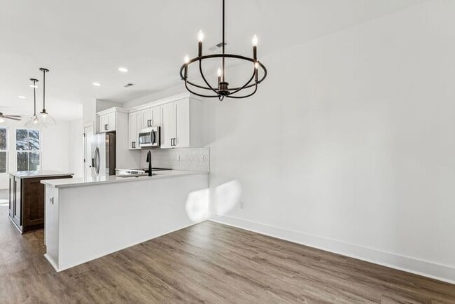 Building Photo - High-End 2BR Townhome | Rooftop Terrace + 2-Car Garage | 24-Unit Community