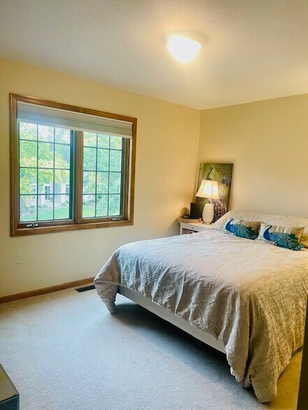 Large, spacious bedroom with natural light. - 18679 Pathfinder Dr