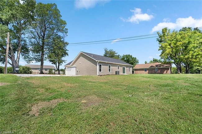 Building Photo - Earn Wealth While Leasing - Like a Homeown...