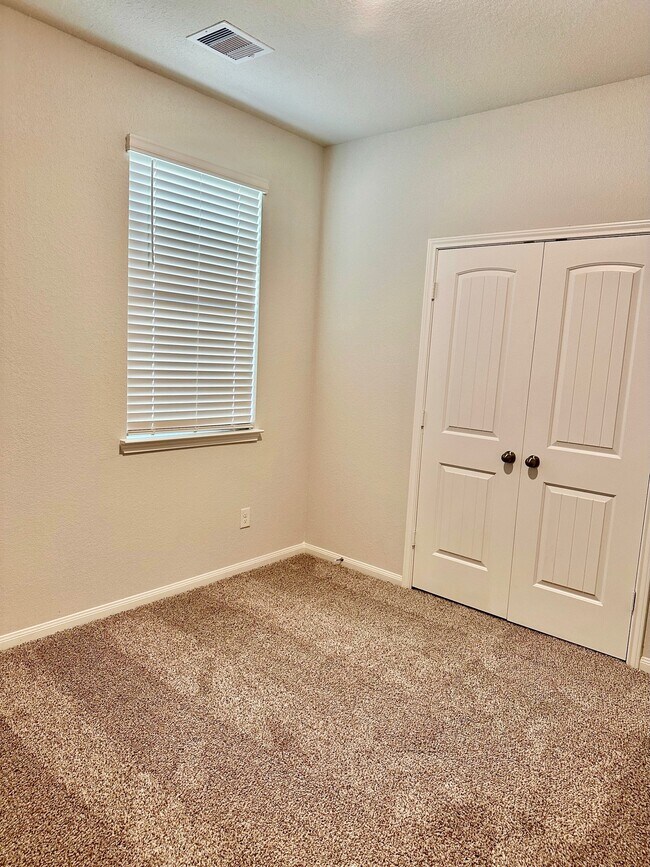 The secondary bedrooms all feature carpet, spacious closets and blinds! - 507 Turtle Dove Dr