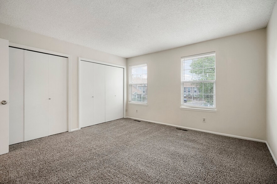 White and bright primary bedroom - 11554 Community Center Dr