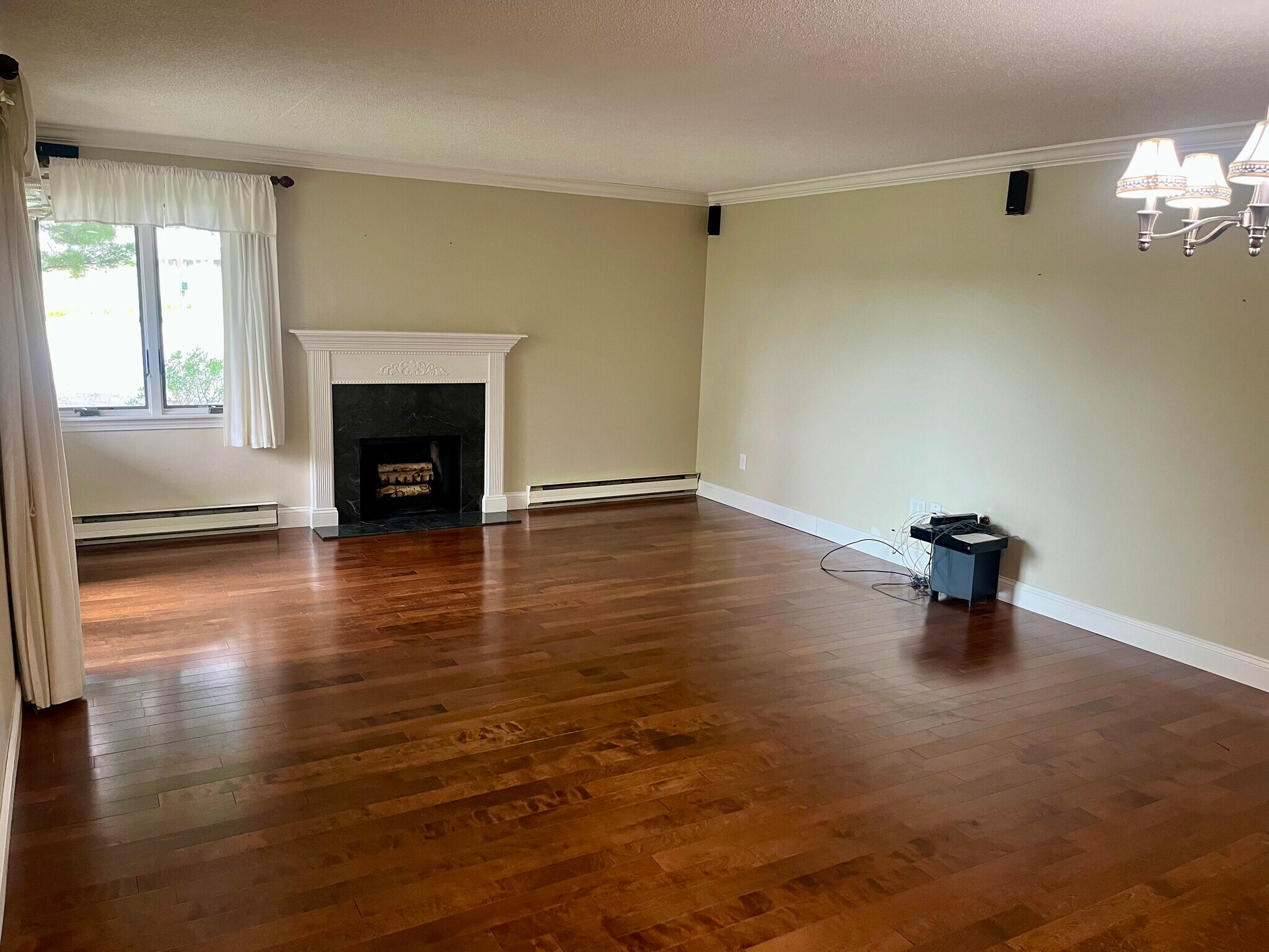 Living room with fireplace and hard wood floors - 77 Windward Ln