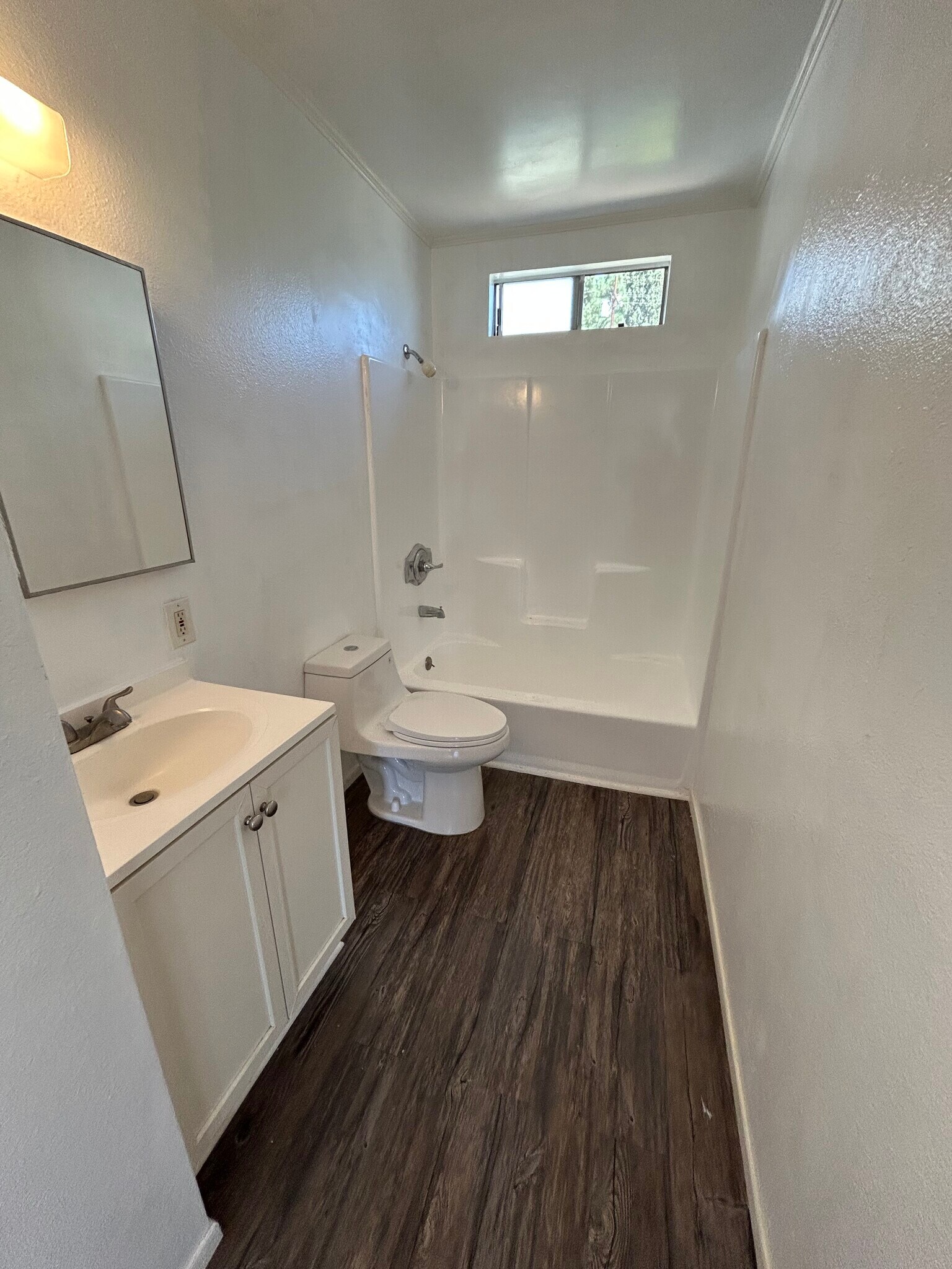 1st restroom with newly installed flooring and toilet - 1156 N Chicago St