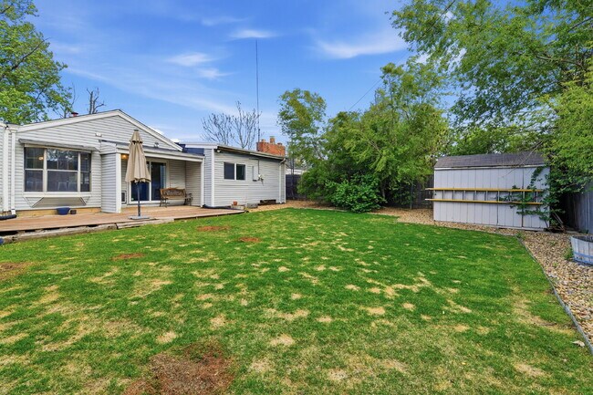 Building Photo - $3,045.95, 3 bed, 2 bath house in Denver with Fenced in Yard and In Unit Laundry!