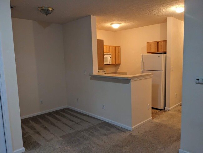 View of kitchen and dining table nook from living room - 3881 E Barrington Dr