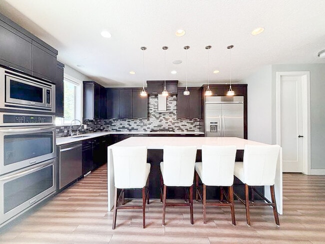 Building Photo - Luxury 5-Bedroom Rental with Pool, Finishe...