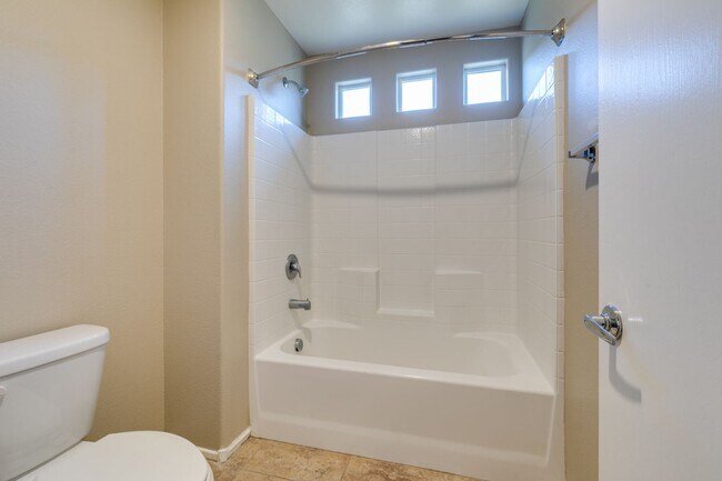 Building Photo - Spacious Townhouse with Loft & Rare 3-Car Garage!