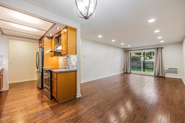 Building Photo - Sweet & Cozy 2/1 condo available in Mt. Park with covered parking, in-unit laundry, outdoor pool ...