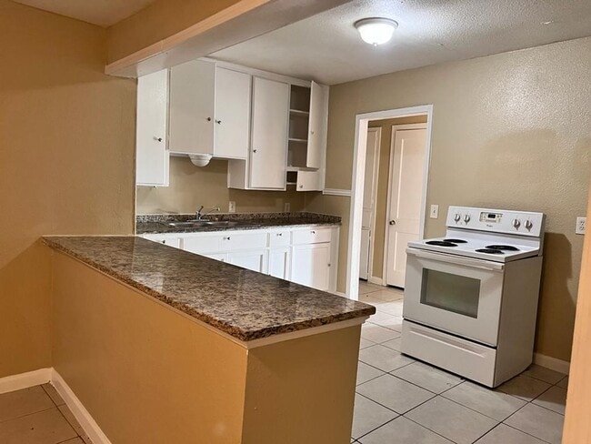 Building Photo - Completely Renovated, huge back yard and close to everything!