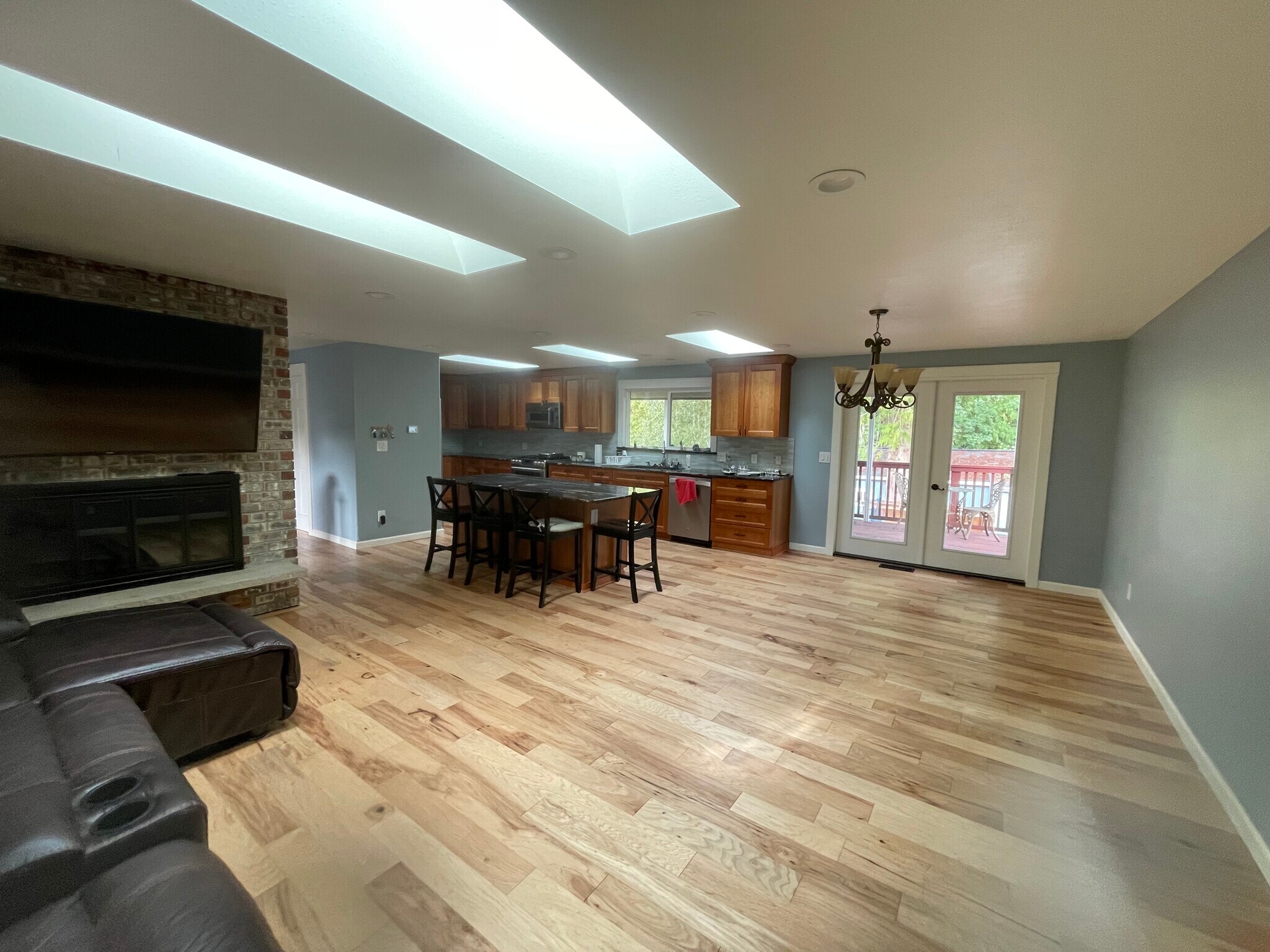open concept kitchen, living and dining with French doors to back deck - 2186 Evergreen Ave SE