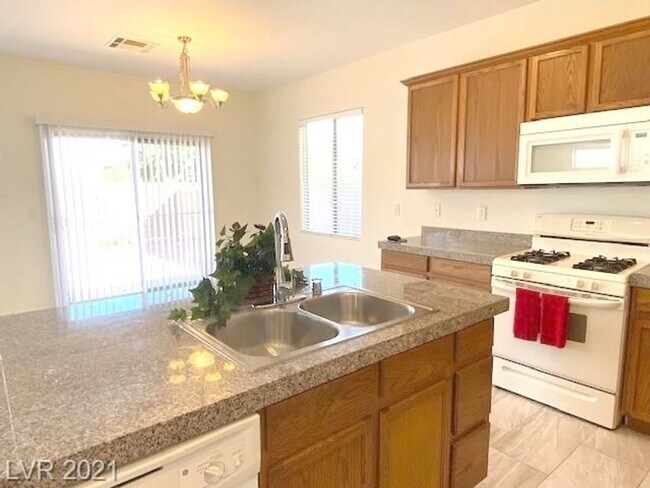 Building Photo - Gated Community! Fabulous 4 Bedrooms Plus Large Loft. One Bed and Bath Downstairs.