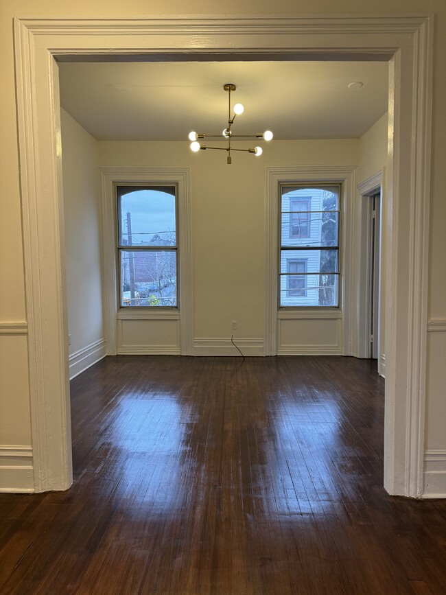 Front room faces street, large windows, high ceilings and plenty of light! - 118 Philip St