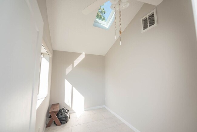 Building Photo - Welcome to this spacious three-bedroom, three-bath home in the heart of Palm Bay