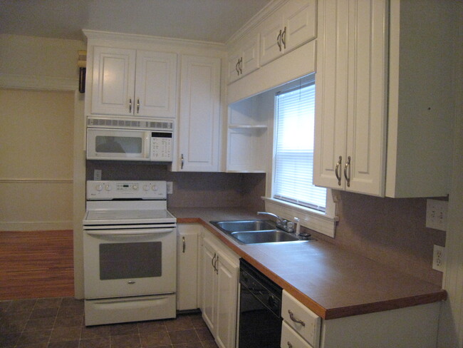 Kitchen to dining room view. - 1911 E 4th St