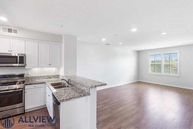 Building Photo - Modern Tri-Level Townhome with Office, 2-Car Garage & Prime Anaheim Location!