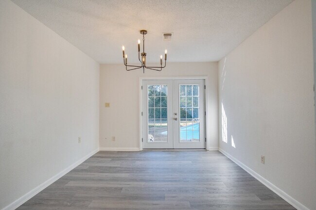 Building Photo - Stunning 4BR/2BA Pensacola Home with Private Pool, Modern Kitchen, Luxury Vinyl Flooring, Fully F...