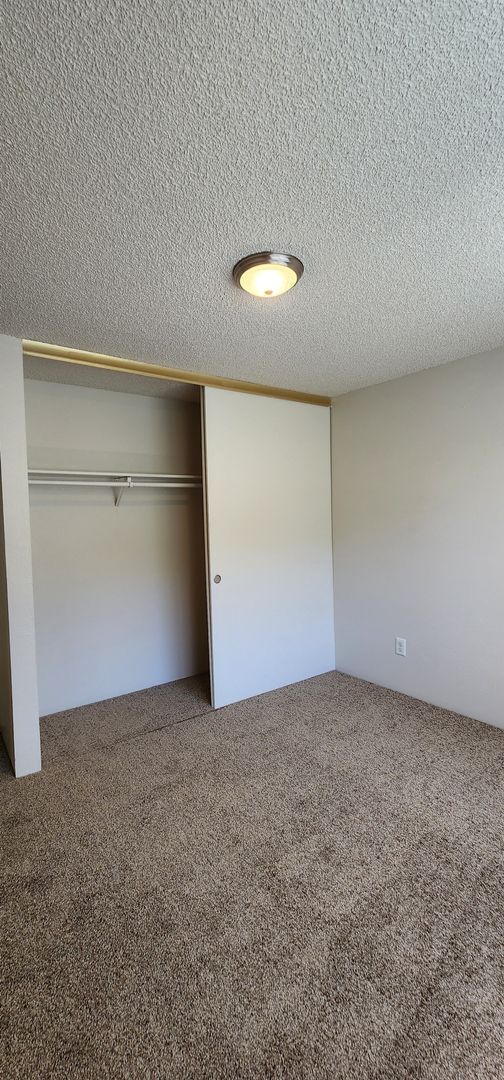 Building Photo - Ground-Level Apartment Available Now at Sunset Villa!