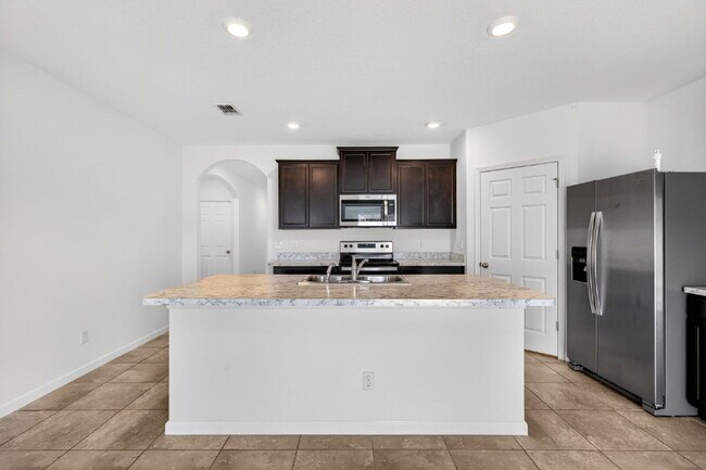 Building Photo - Renovated 4 Beds 2 Baths Single Family on Over a QTR Acre lot | Huge Yard