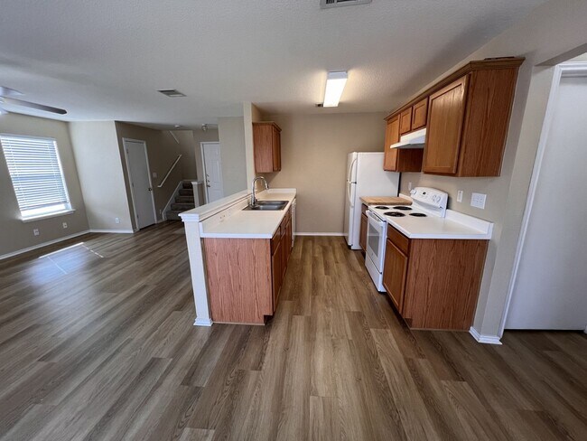 Building Photo - Generous Outdoor Space & Lawn Care Included!