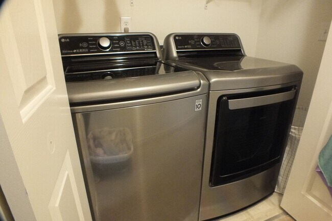 Building Photo - Spacious End-Unit 3-Bedroom Townhouse with 2-Car Garage & Central AC