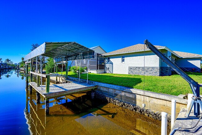 Building Photo - Waterfront Furnished Pool Home with Gulf & Canal Views in Estero Bay Shores