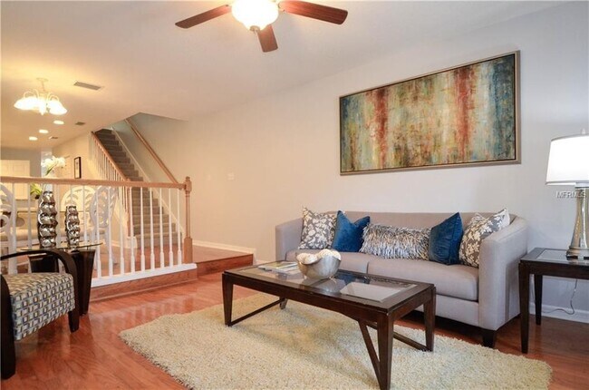 living room-new water heater. Installed 2021. New wood flooring installed 2022 - 4210 W Gray Street Unit 1