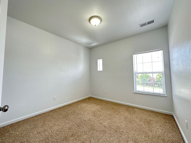 Building Photo - 4 bedrooms, 2 1/2 Baths with a 3 Car Garag...