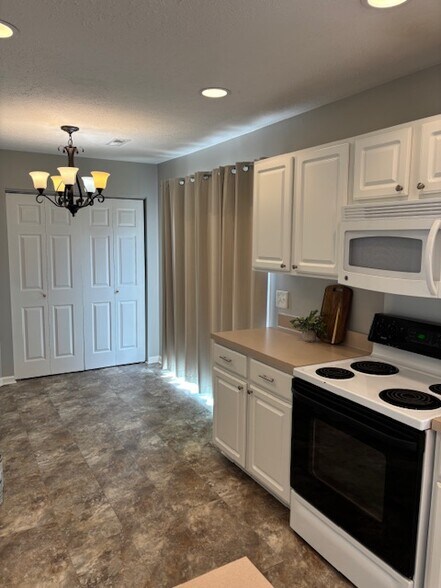 Kitchen/Laundry Closet/Slider to Back Yard - 1712 Stone Hollow Ct