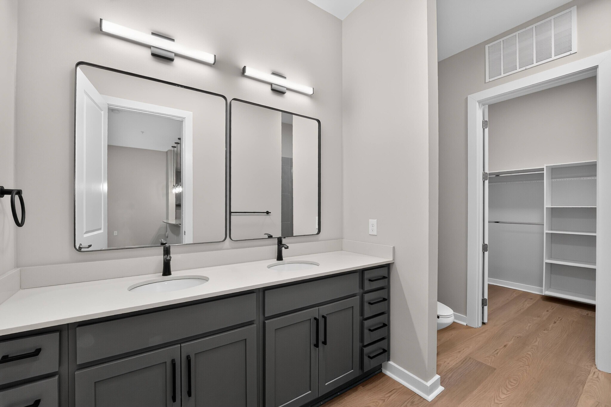 Matte Black Fixtures* with Grey Cabinetry - The Aster Cary
