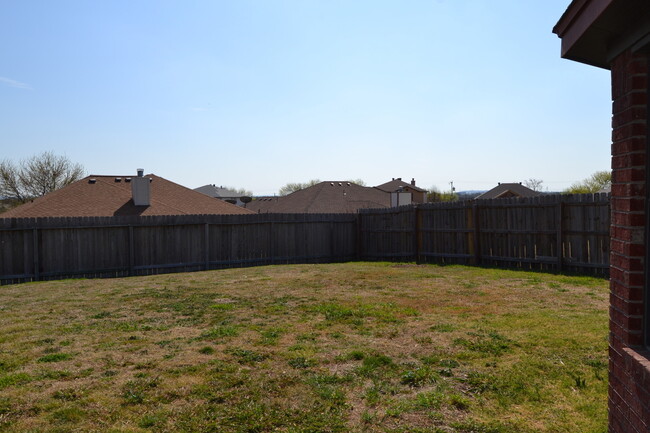 Building Photo - All brick beauty with fireplace and fenced...