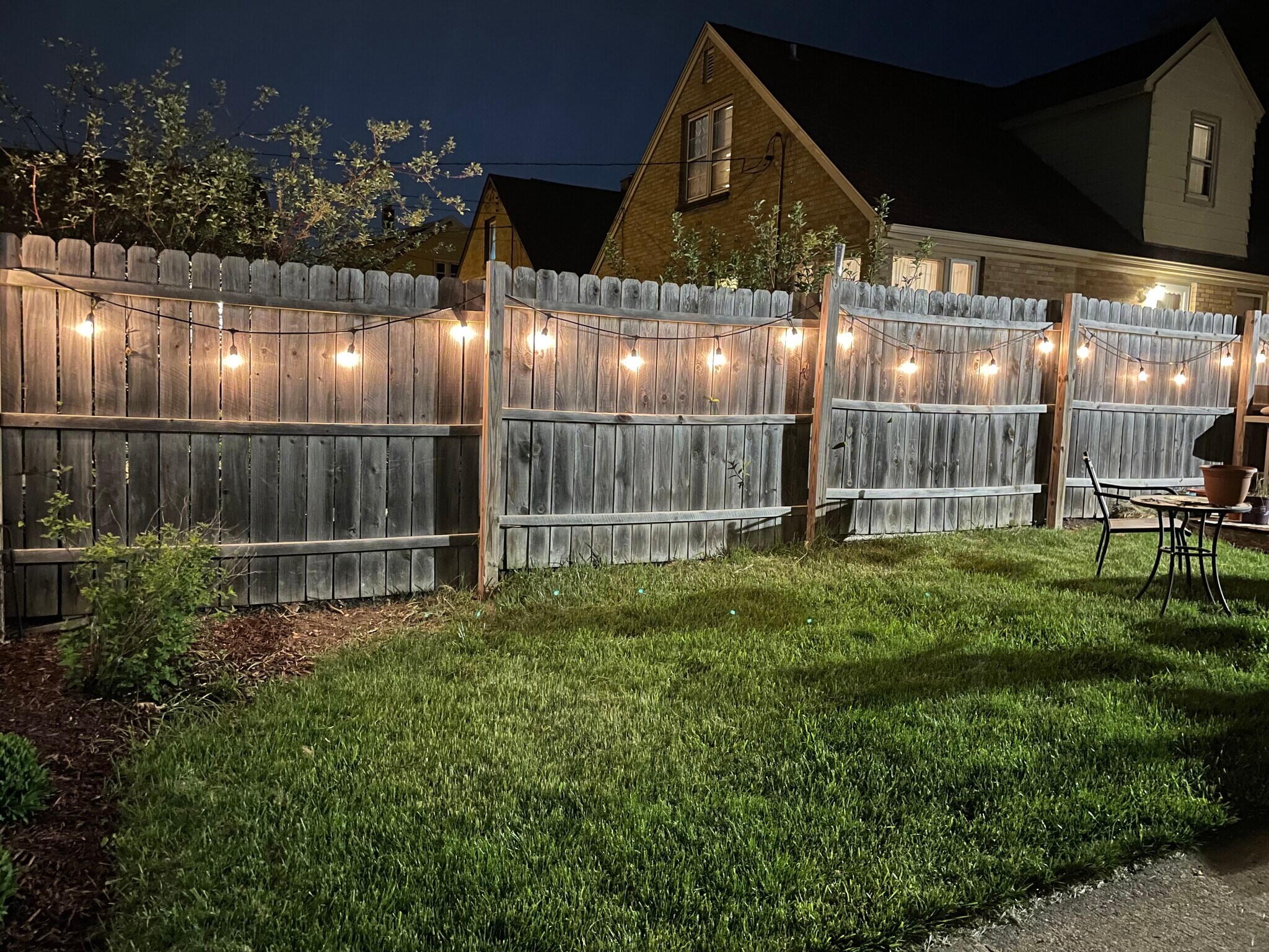 Backyard fence at night - 3633 S 19th St