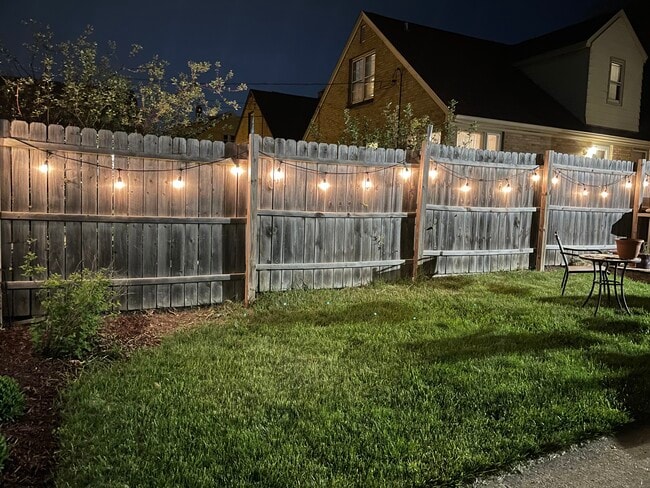 Backyard fence at night - 3633 S 19th St