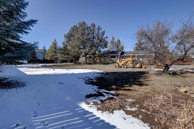 Building Photo - 1/2 acre in the with RV Hook ups