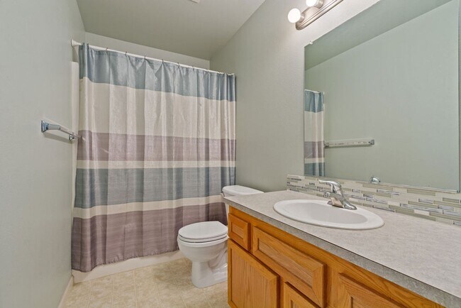 Building Photo - SPACIOUS LAYOUT! HARD SURFACE FLOORING, FENCED YARD & LARGE PATIO!