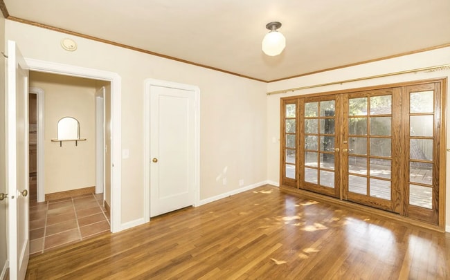 Building Photo - Charming Spanish Style Cottage with Incredible Deck- Gardener's Delight!