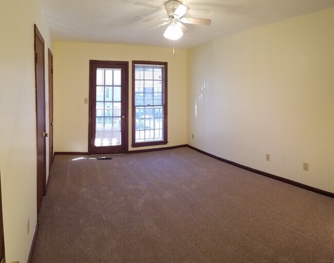 Master bedroom with easy access to private balcony. - 120 Colonial Ct