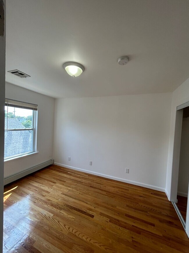 Building Photo - Discover Your Dream Home in Neptune: Spacious 4-Bedroom, 2.5-Bath with Private Backyard and Drive...