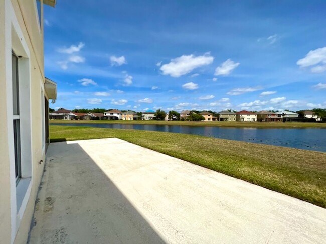 Building Photo - EAGLE CREEK LAKE NONA! WELCOME HOME! Beautiful water views! Spacious 2 story-3 bedroom 2.5 bath h...