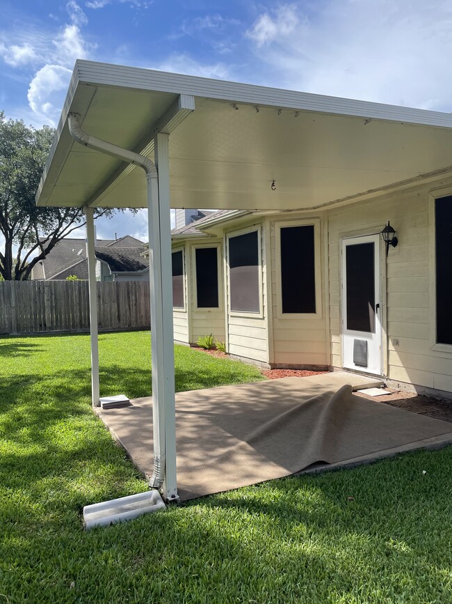 Covered Patio showing doggie door entrance in door - 3511 Misty View Ln